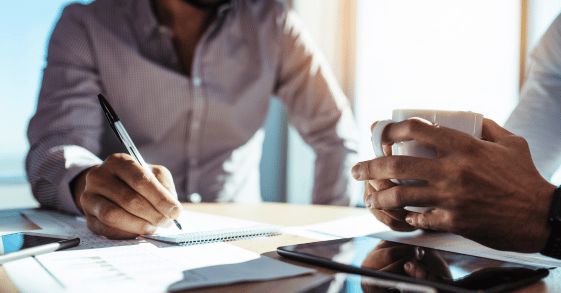 Business administration students collaborating on coursework