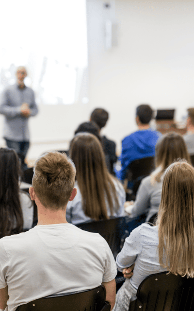 Students attending a lecture in a classroom