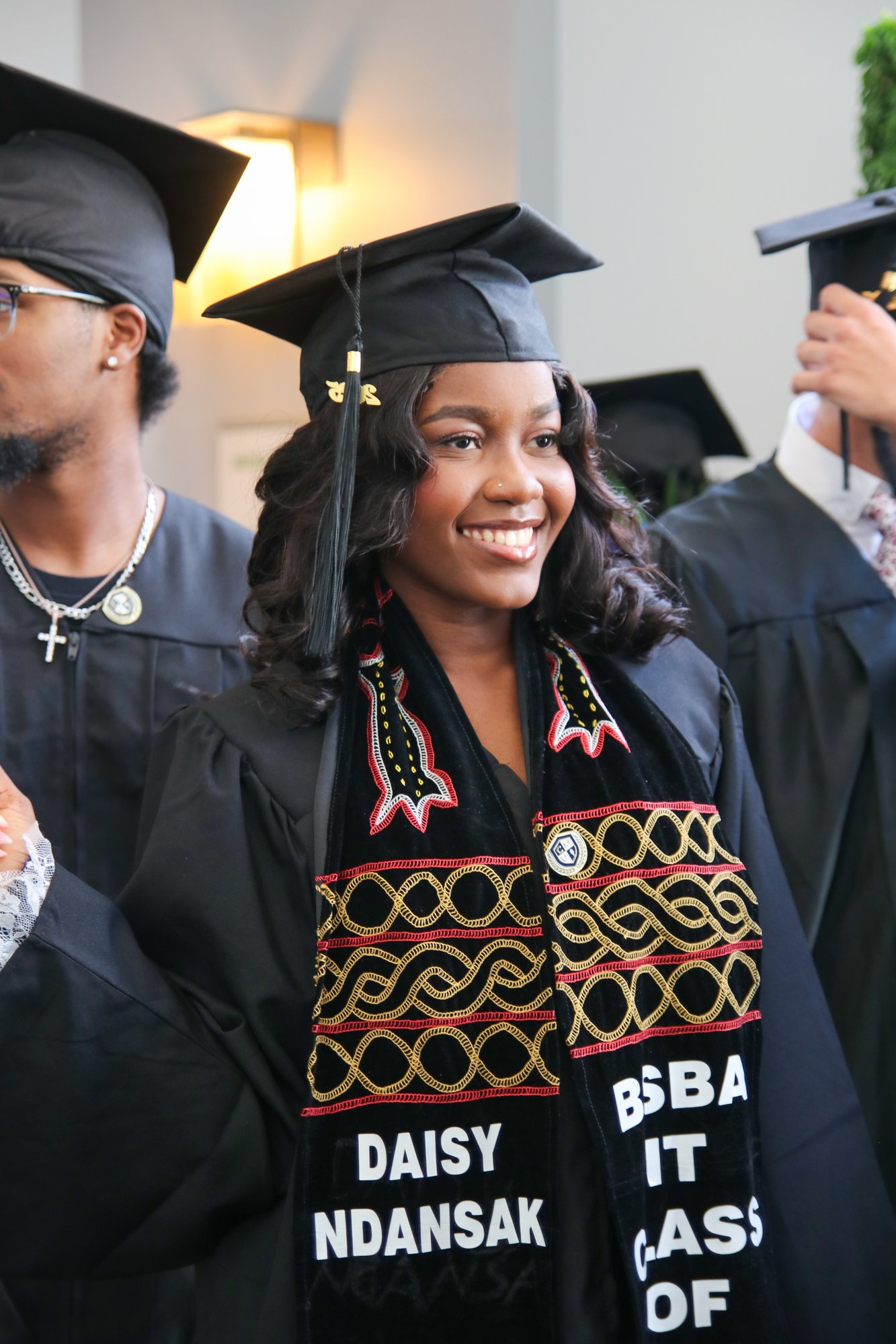 CalMU graduate wearing decorated stole at commencement