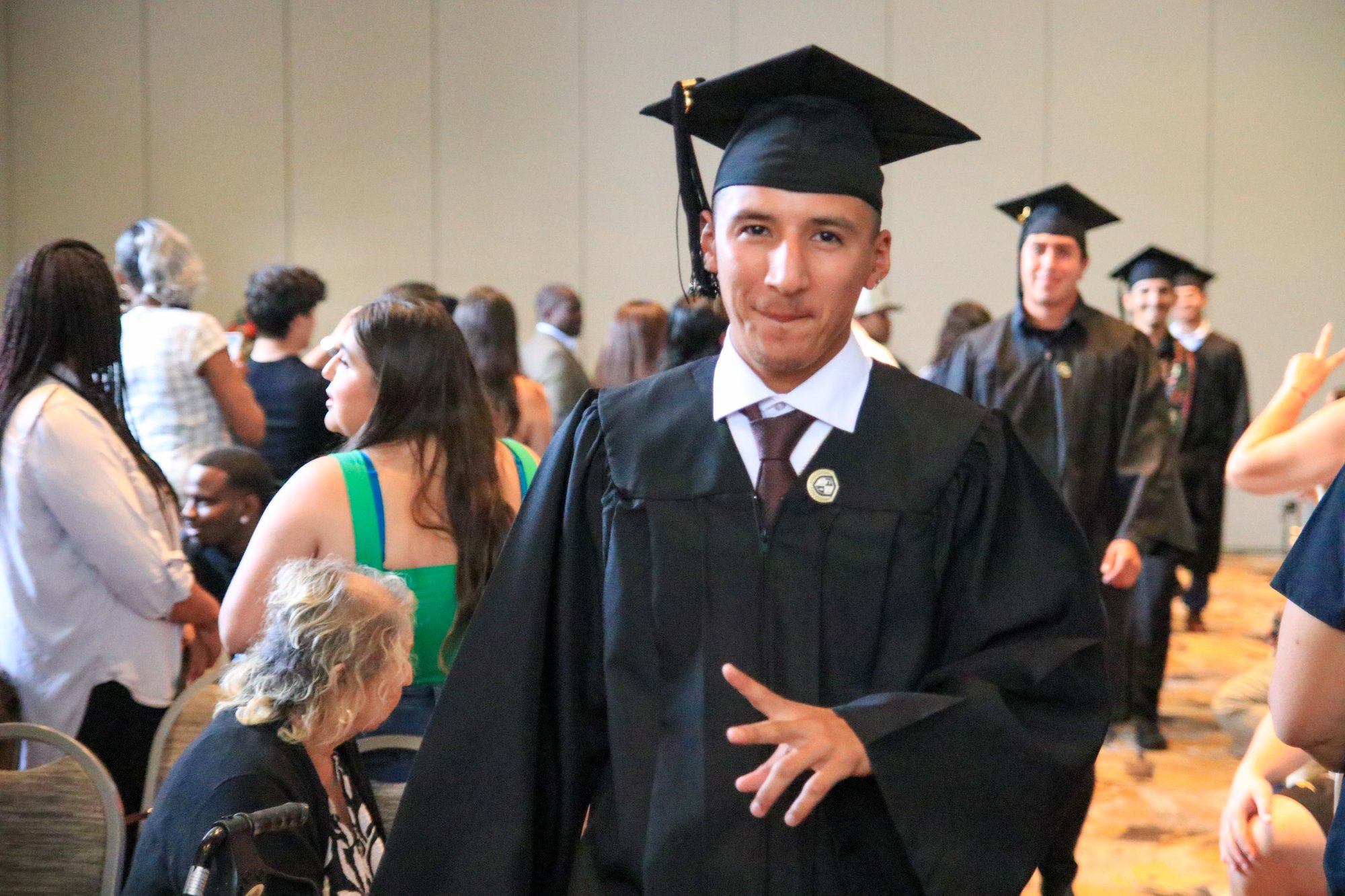 CalMU graduate with family at commencement ceremony