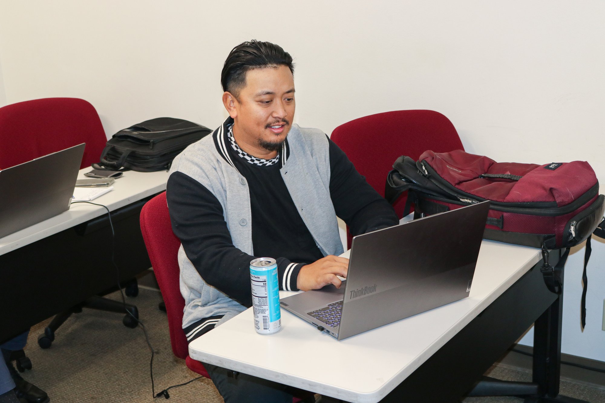 CalMU student studying on a laptop in campus c
