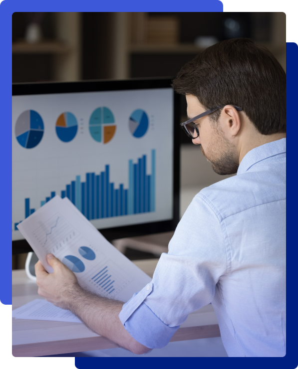 Business professional reviewing data analytics reports and charts