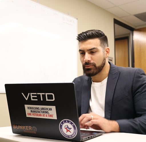 va_student_working_laptop