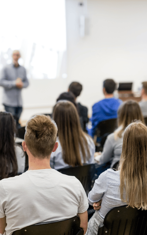 Students attending a lecture in a classroom